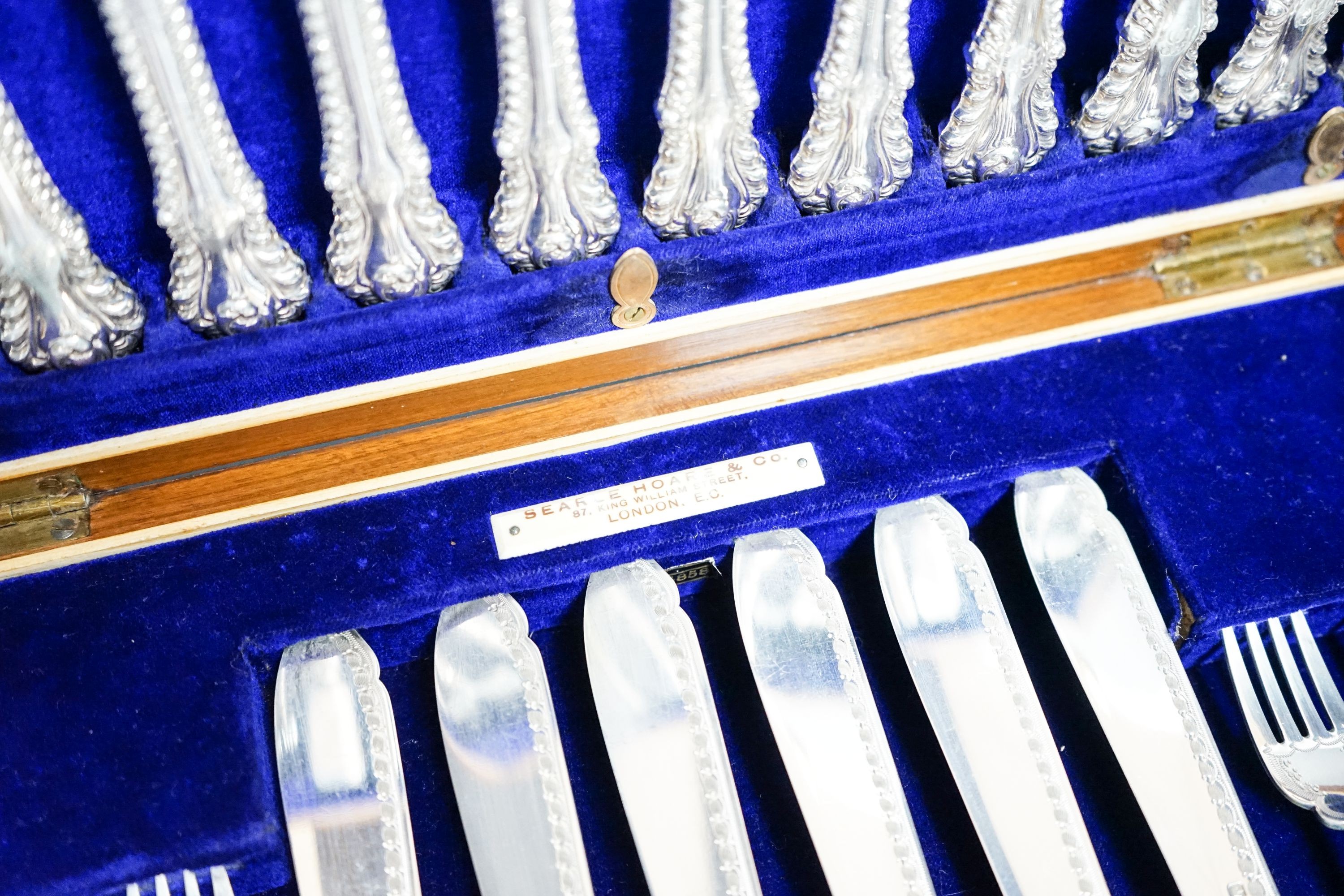 A cased set of twelve pairs of Edwardian silver fish eaters, Allen & Darwin, Sheffield, 1909 (loaded handles)